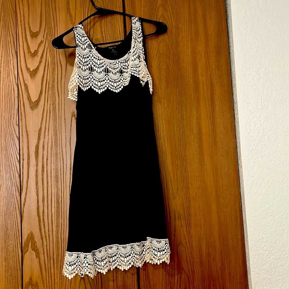 Women’s black top with white lace